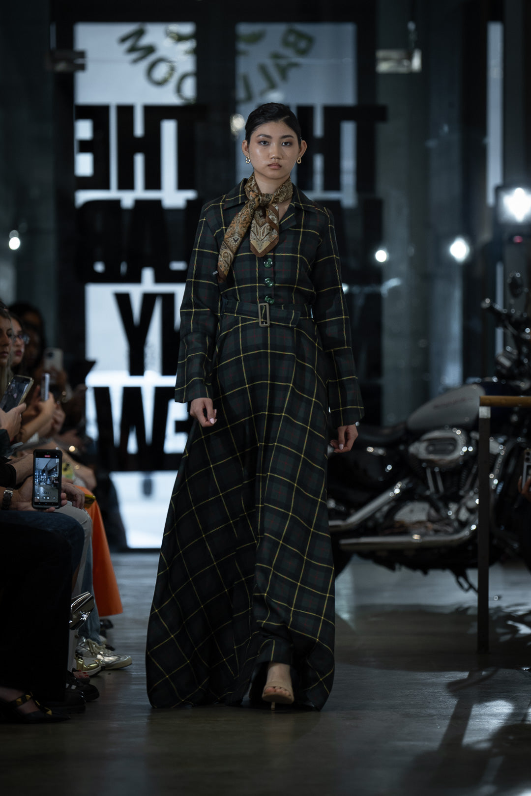Model walks down the runway wearing Highland Plaid Dress